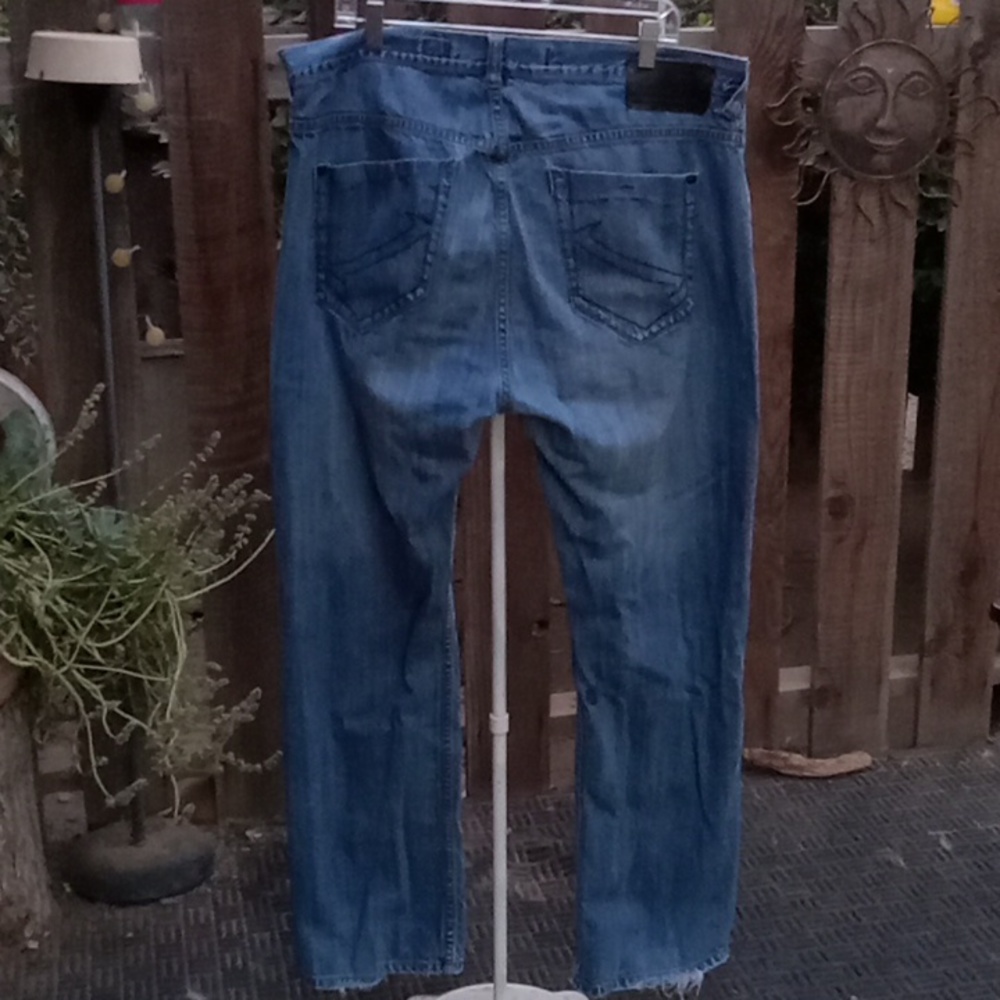 Men's denim jeans, raw trashed and trashed den.